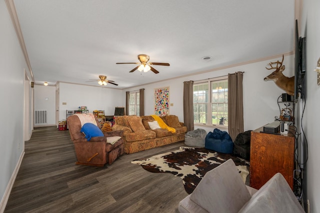 living room with ornamental molding, ceiling fan, and dark hardwood / wood-style floors