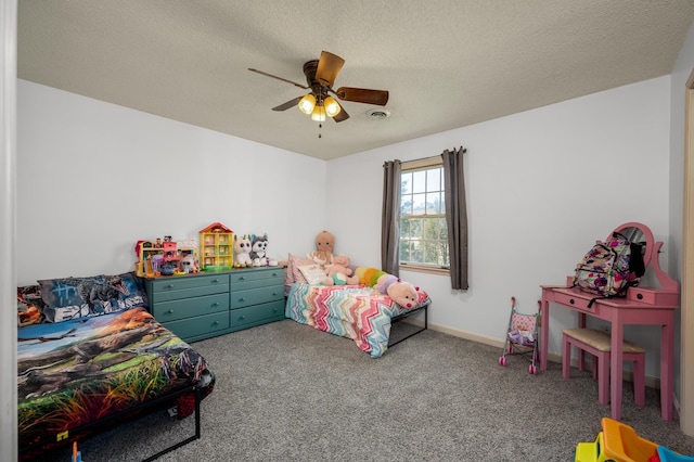 bedroom featuring ceiling fan, carpet floors, and a textured ceiling