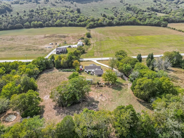 birds eye view of property with a rural view