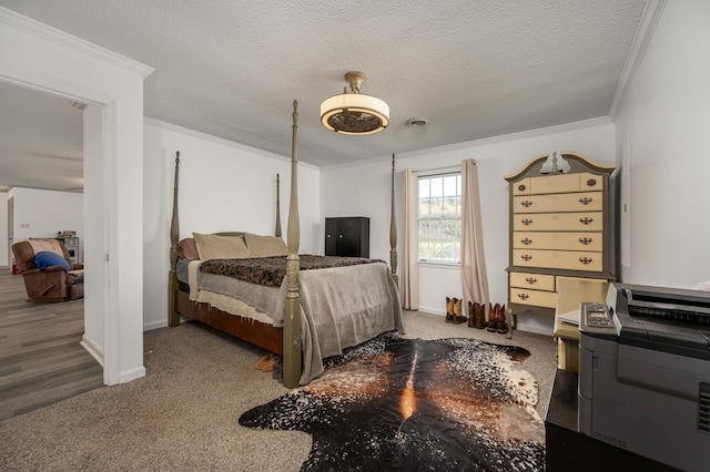 bedroom with crown molding, dark hardwood / wood-style flooring, ceiling fan, and a textured ceiling