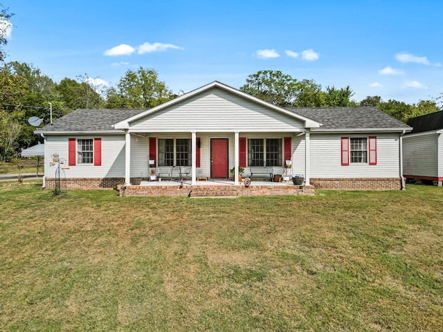 ranch-style house with a porch and a front yard