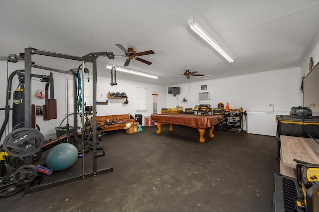 garage featuring a workshop area and ceiling fan