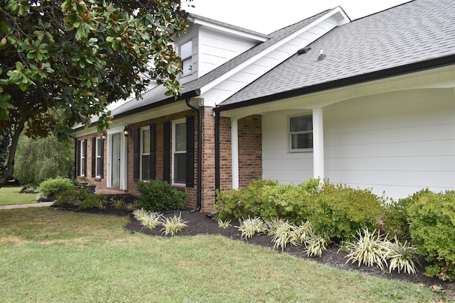 view of property exterior featuring a yard