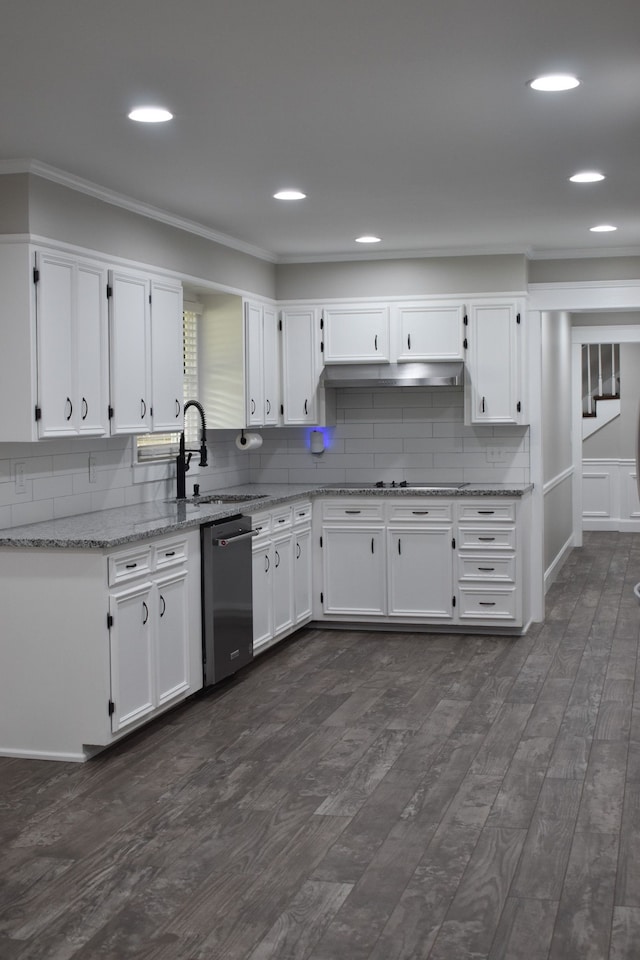 kitchen with dishwasher and white cabinetry