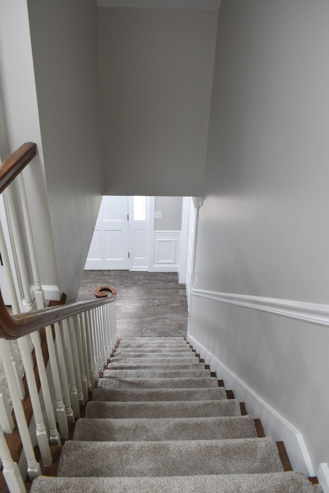 stairway with wood-type flooring