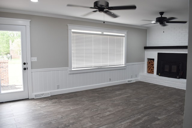 unfurnished living room featuring dark wood-type flooring, ceiling fan, and a fireplace