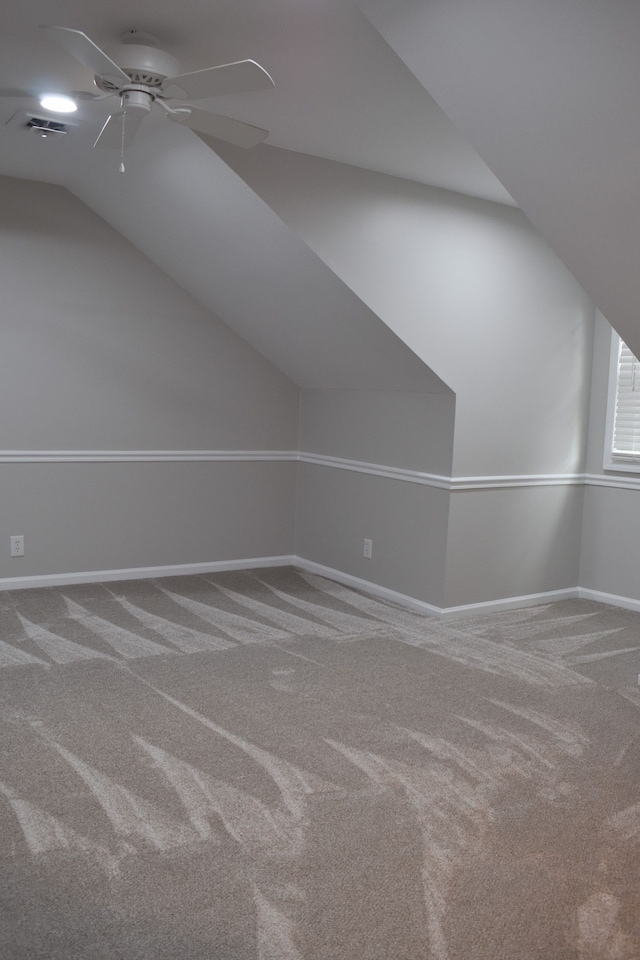 bonus room featuring vaulted ceiling, ceiling fan, and carpet