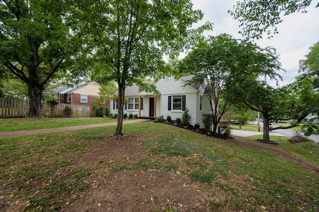 ranch-style home with a front lawn