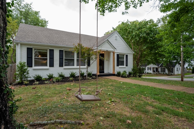 ranch-style house with a front lawn