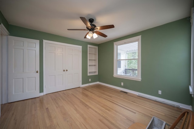 unfurnished bedroom featuring a closet, ceiling fan, and light hardwood / wood-style floors