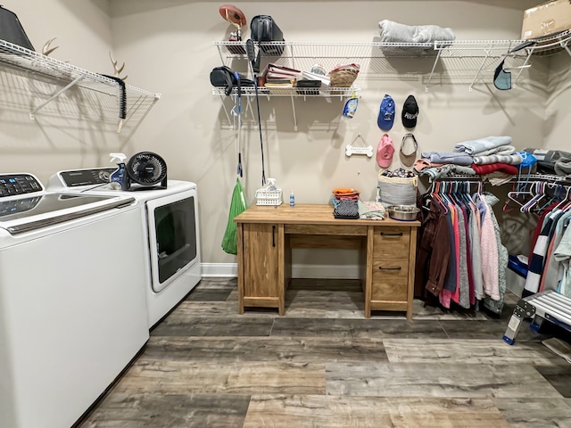 laundry room with dark wood-type flooring and independent washer and dryer