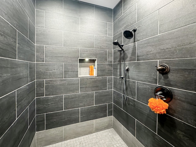 bathroom with tiled shower