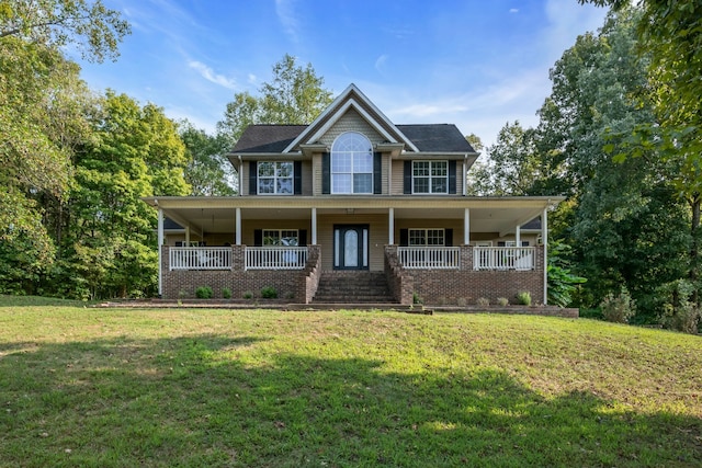 view of front of house featuring a front yard and covered porch