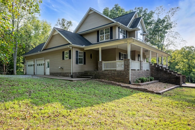 view of side of home featuring a porch, a garage, and a lawn