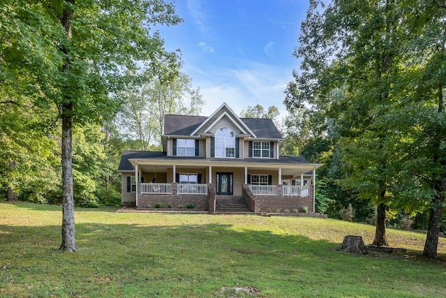 view of front of property with a porch and a front lawn