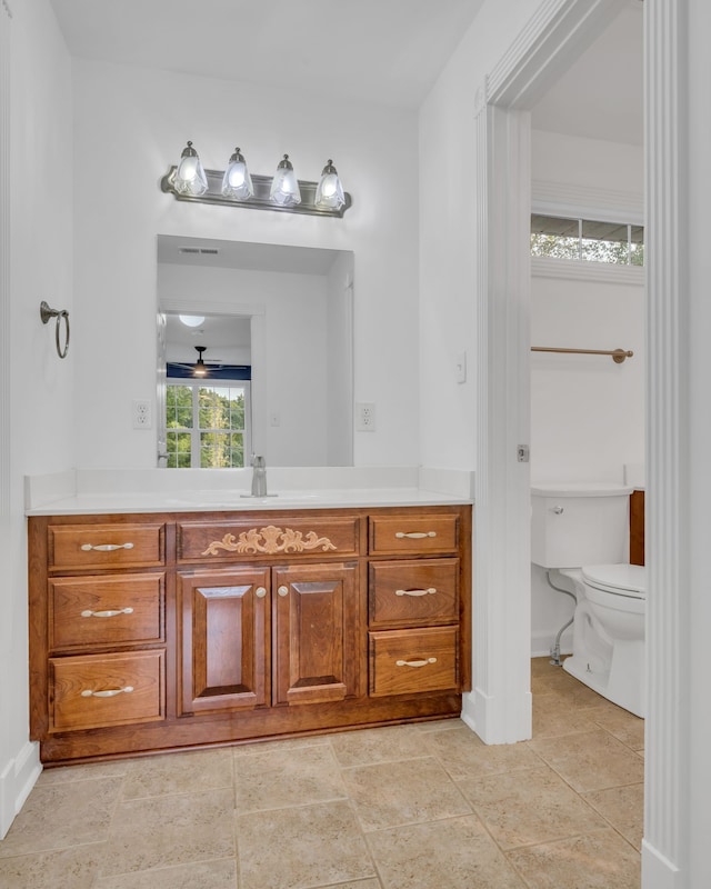 bathroom with vanity and toilet