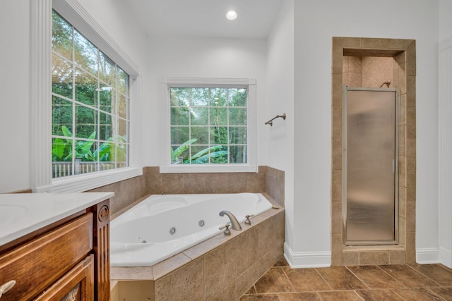 bathroom with vanity and plus walk in shower