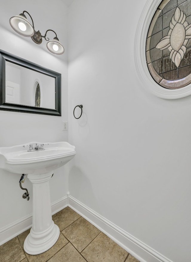 bathroom with tile patterned floors