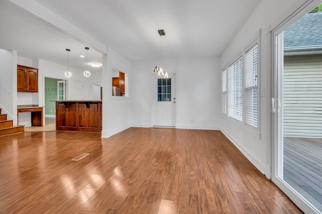 unfurnished living room with light hardwood / wood-style floors