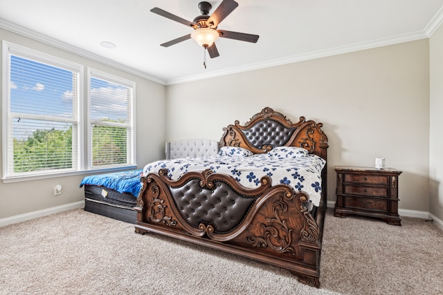 carpeted bedroom with ceiling fan and ornamental molding