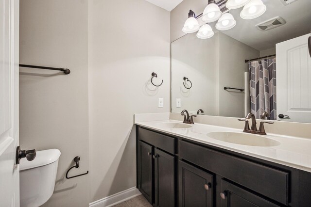 bathroom with vanity and toilet