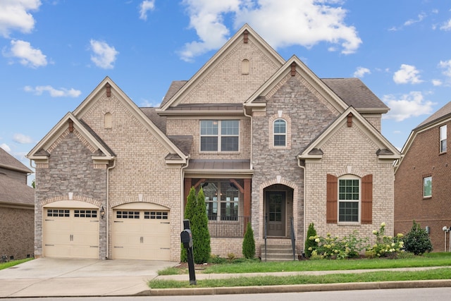 view of front facade with a garage and a front lawn