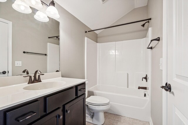 full bathroom featuring tile patterned floors, vaulted ceiling, toilet, shower / bathing tub combination, and vanity