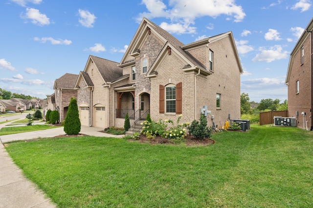 view of front of property with cooling unit and a front lawn