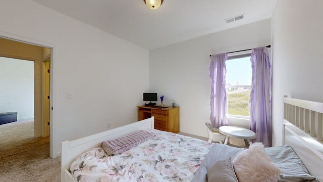 bedroom with light carpet