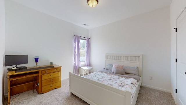 bedroom with light carpet