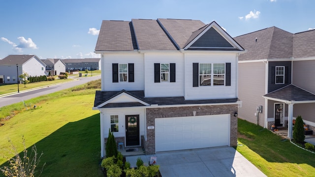 view of front facade featuring a garage and a front lawn