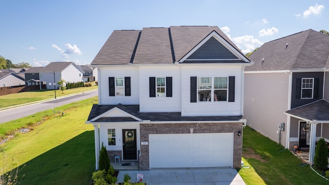 view of front of house with a garage and a front lawn