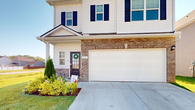 view of front facade with a garage and a front yard