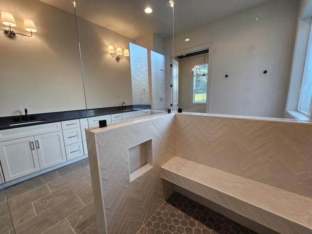 bathroom with tile patterned flooring and vanity