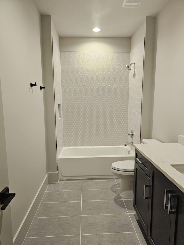 full bathroom with tile patterned flooring, vanity, toilet, and tiled shower / bath