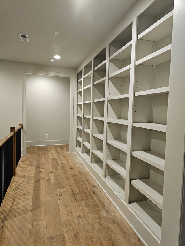 hallway featuring hardwood / wood-style flooring