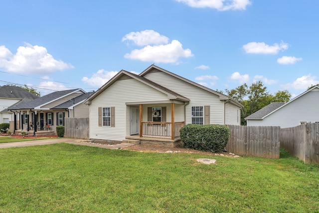 bungalow-style house featuring a porch and a front lawn