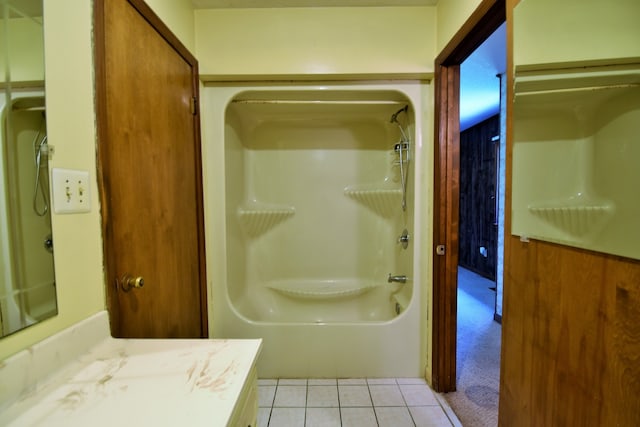 bathroom featuring vanity, tile patterned floors, and wooden walls