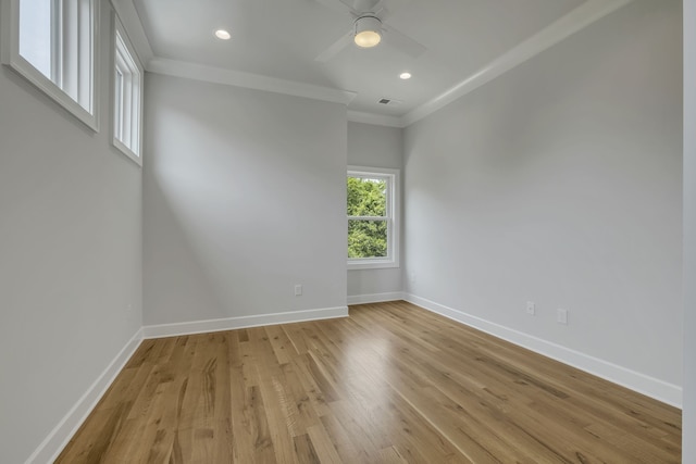 empty room with crown molding, light hardwood / wood-style flooring, and ceiling fan