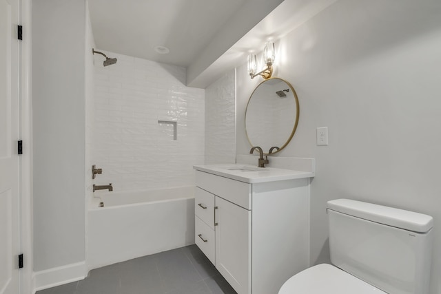 full bathroom featuring tiled shower / bath combo, vanity, toilet, and tile patterned flooring