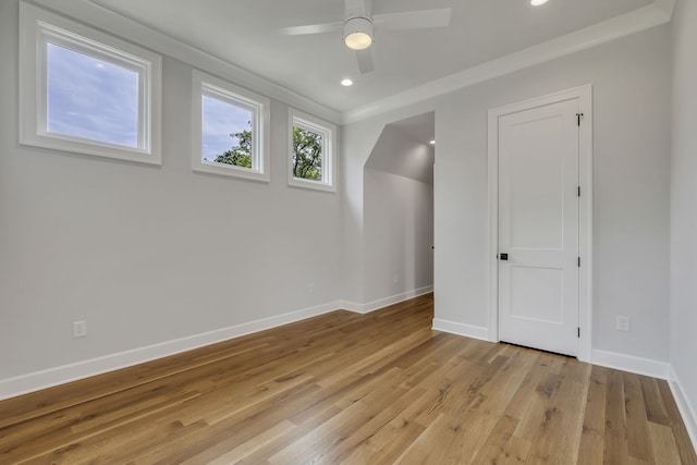 spare room with ceiling fan and light hardwood / wood-style floors