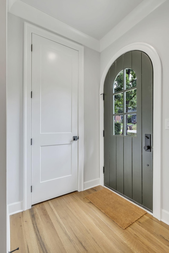 2704 Westwood Ave, Nashville, TN 37212 - foyer entrance with baseboards, arched walkways, and light wood-style floors