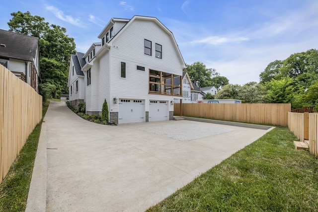 exterior space with a yard and a garage