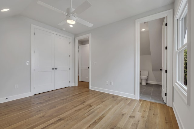 2704 Westwood Ave, Nashville, TN 37212 - unfurnished bedroom with a closet, light wood finished floors, ensuite bath, and baseboards