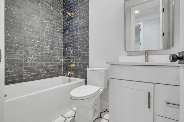 full bathroom featuring tiled shower / bath, toilet, and vanity