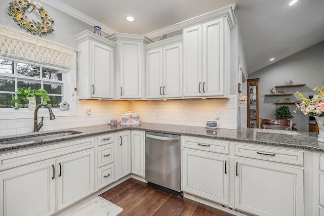 kitchen featuring white cabinetry, dark hardwood / wood-style flooring, sink, lofted ceiling, and stainless steel dishwasher