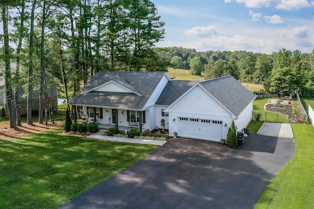 view of front of home featuring a front lawn and covered porch