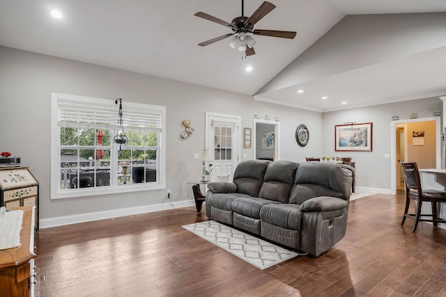 living room with vaulted ceiling, ceiling fan, and dark hardwood / wood-style flooring