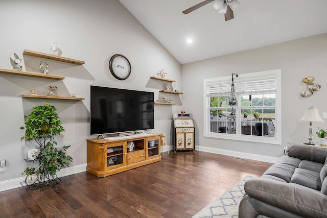 living room with ceiling fan, dark hardwood / wood-style floors, and high vaulted ceiling