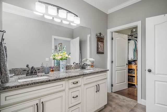 bathroom featuring ornamental molding, vanity, and hardwood / wood-style flooring